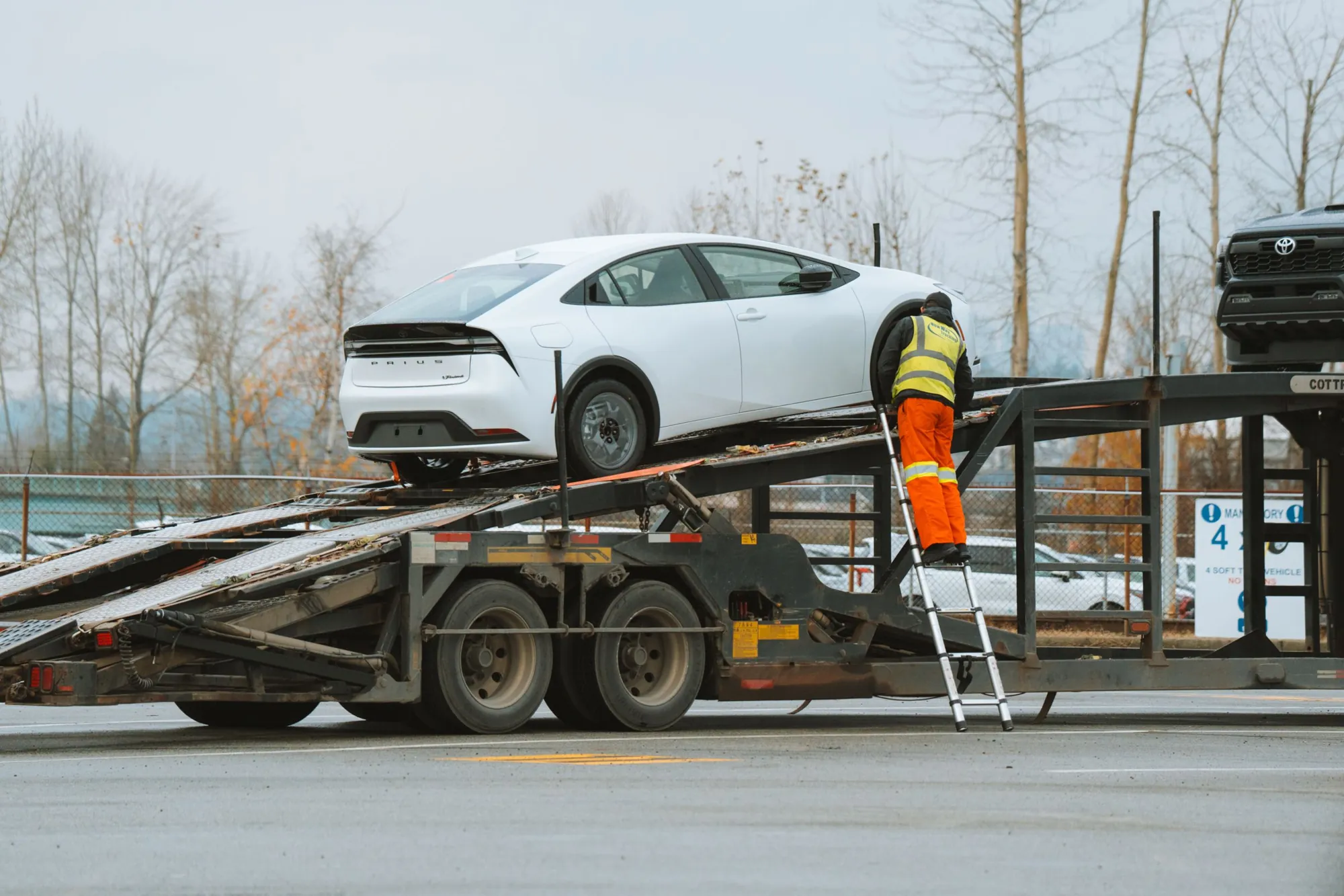 Operator loading a car onto a car carrier